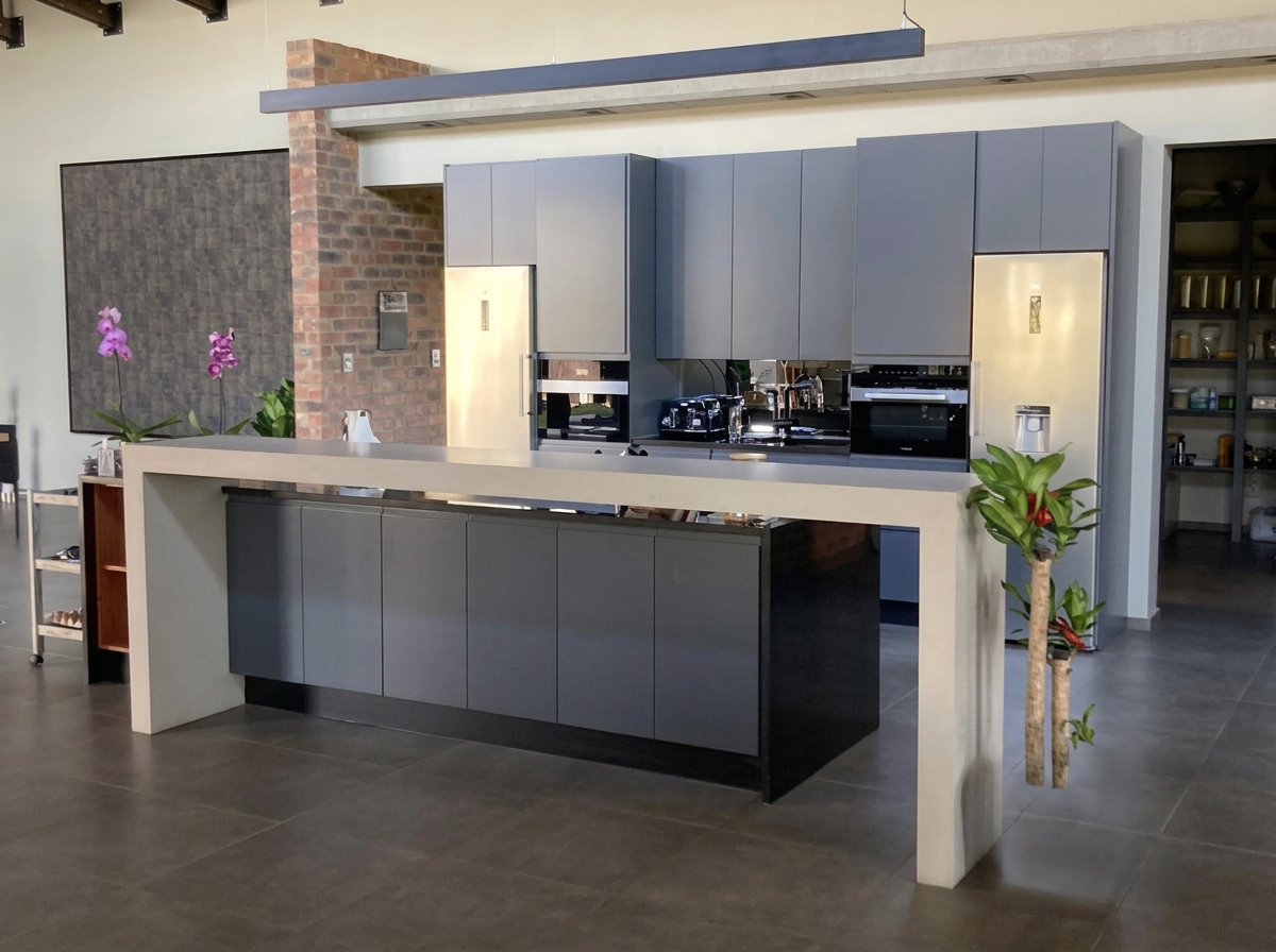 Modern charcoal kitchen with integrated appliances built by Modern Kitchens & Cupboards